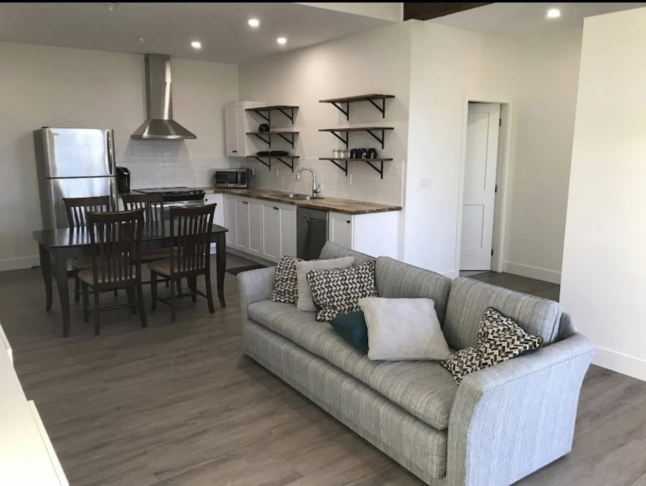 Finished open kitchen and living space after drywall and renovation