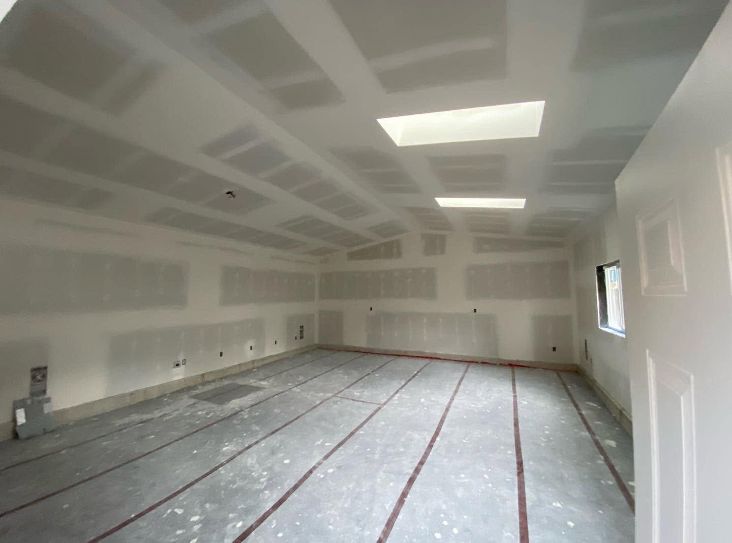 Coffered drywall ceiling with skylights in a large new build